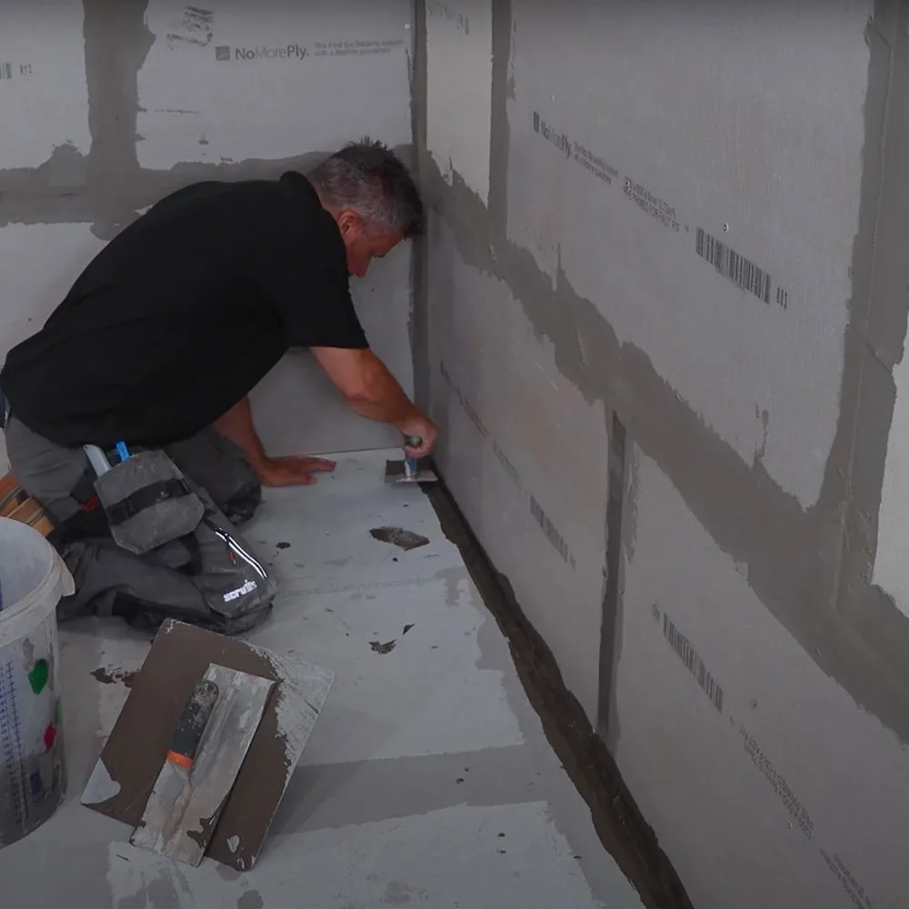 Installing cement board on bathroom walls before tiling